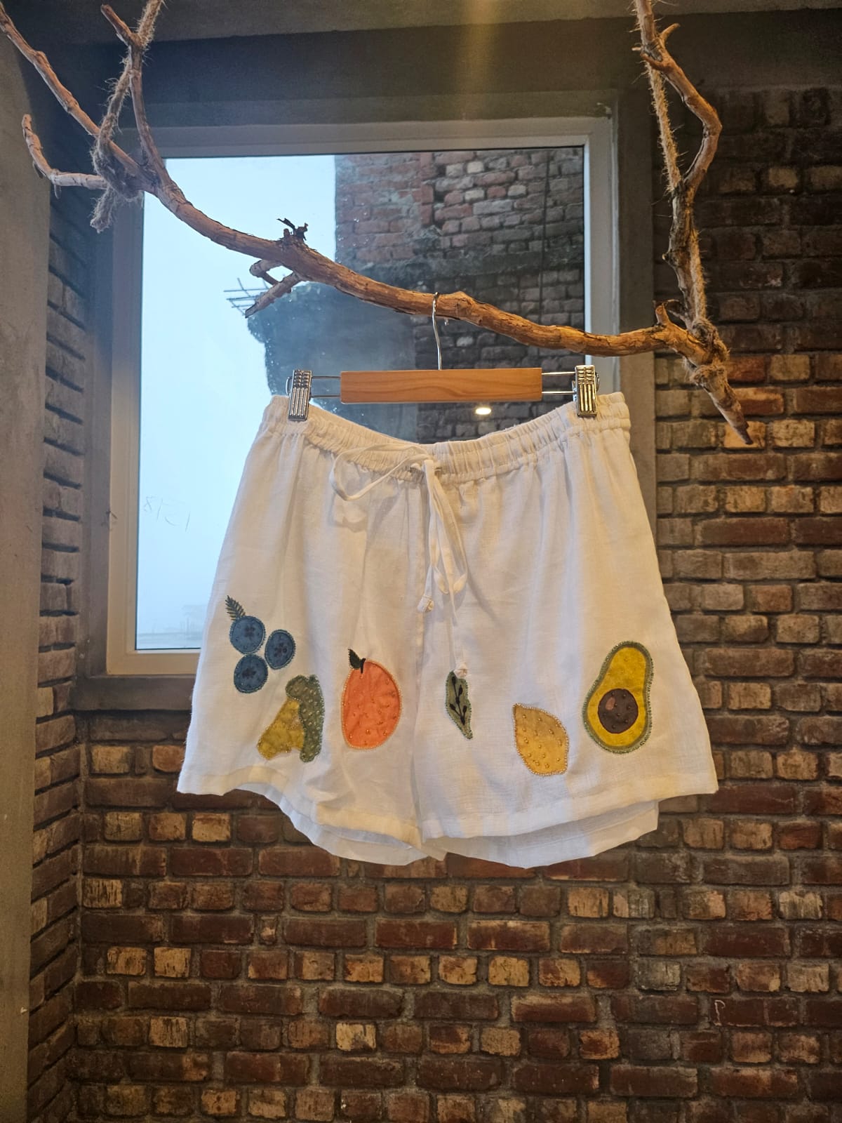 Hand embroidered linen mini grocery shorts